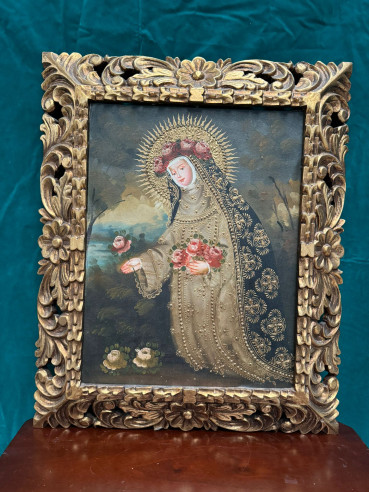 Santa Rosa, óleo sobre lienzo estilo cuzqueño con marco tallado en madera.