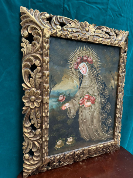 Santa Rosa, óleo sobre lienzo estilo cuzqueño con marco tallado en madera.