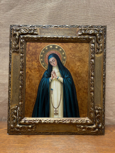 Virgen de la Paloma, pintada sobre tabla con marco de madera.