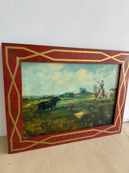 Escena de mayoral a caballo con toro acechando. Firmado y fechado (A. Ruiz 1965) con bonito marco.