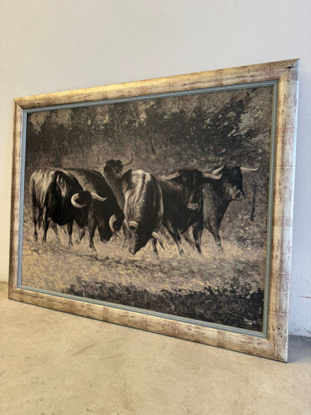 Toros bravos en el campo, pintados sobre tabla por Juan Lara.