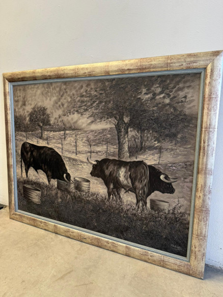 Toros bravos en el campo, pintados sobre tabla por Juan Lara.