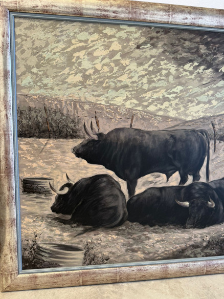 Toros bravos en el campo, pintados sobre tabla por Juan Lara.